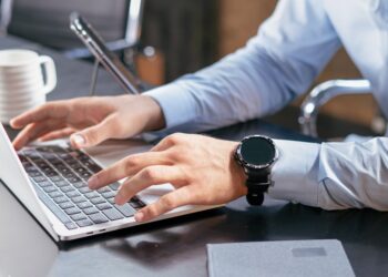 IT admin reviewing an update policy on a laptop screen