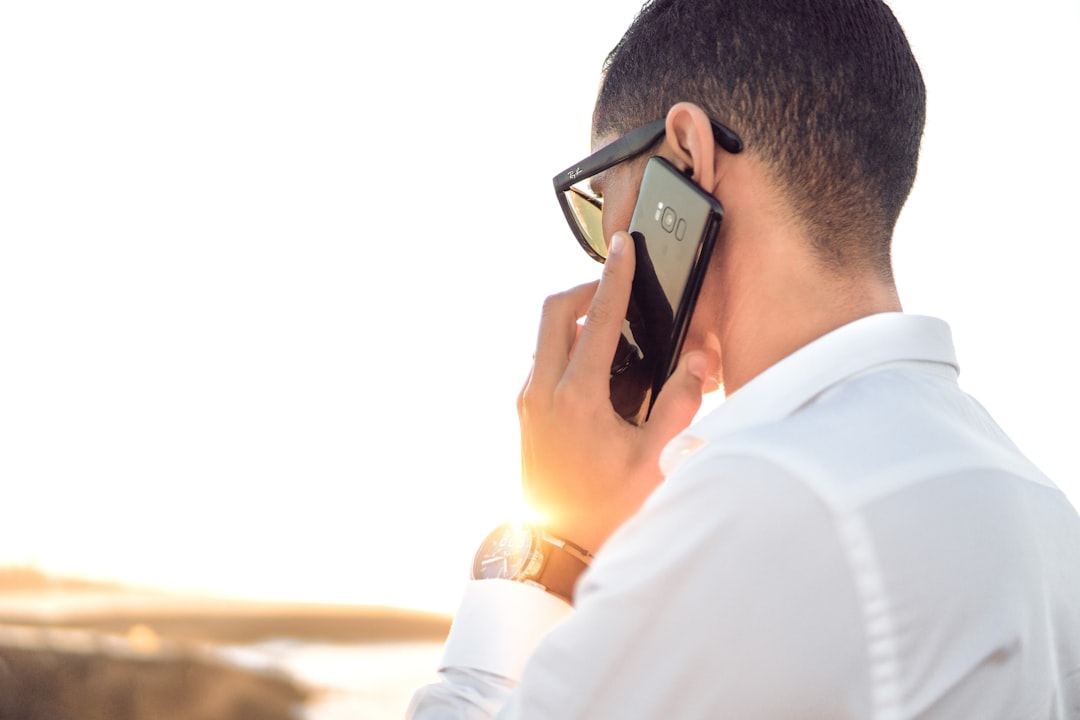 Man calling customer support to question a hosting bill charge