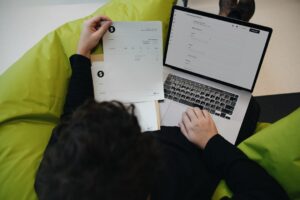 Small business owner checking a hosting bill on a laptop