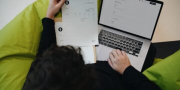 Hosting bill: how to spot hidden charges — photo 1 - STACKwebzine Small business owner checking a hosting bill on a laptop