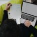 Hosting bill: how to spot hidden charges — photo 1 - STACKwebzine Small business owner checking a hosting bill on a laptop