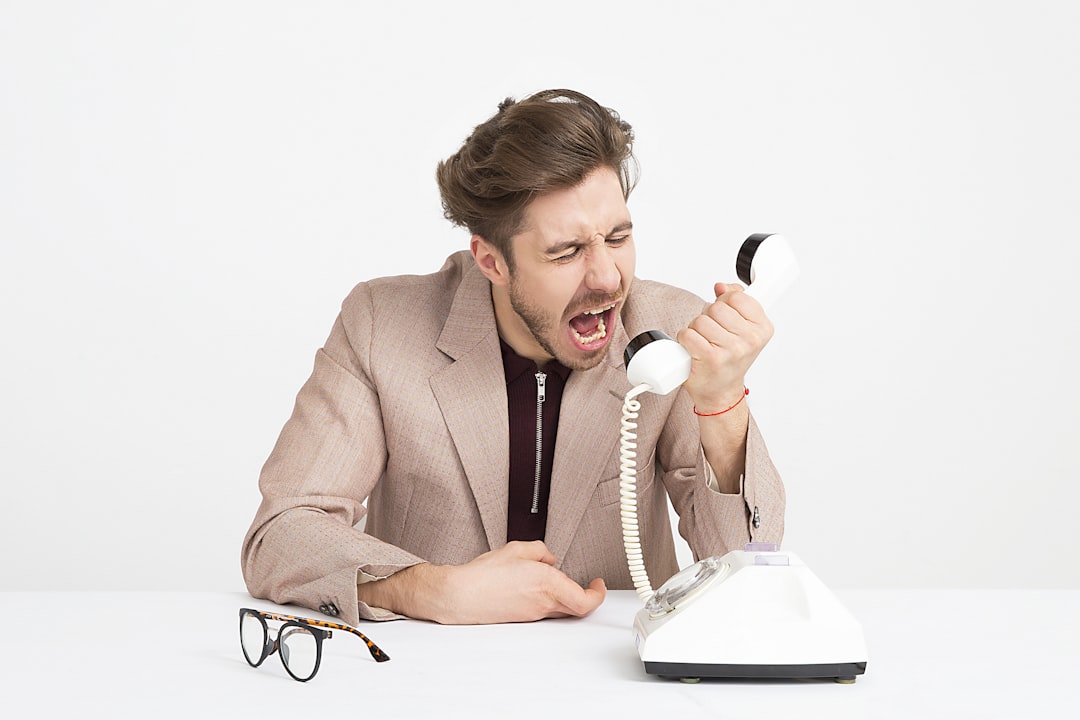Frustrated customer waiting for a human handoff after a failed chatbot reply