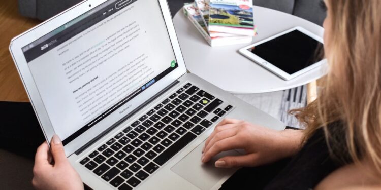 Page builders: choosing without regret later — photo 1 - STACKwebzine Small business owner comparing page builders on a laptop screen