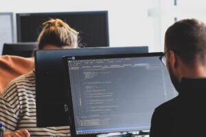 Developer reviewing legacy code before retiring it in production