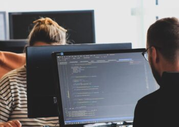 Developer reviewing legacy code before retiring it in production