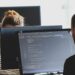 Developer reviewing legacy code before retiring it in production