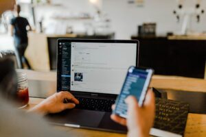 Employee reading suspicious phishing scams message on a work phone