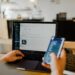 Employee reading suspicious phishing scams message on a work phone