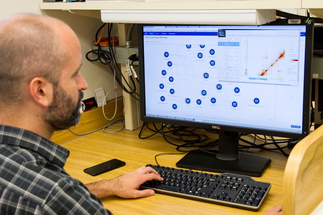 QA engineer checking automated tests results on a monitor