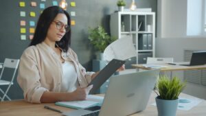 Small business owner checking egress fees on a cloud hosting invoice