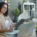 Egress fees are quietly reshaping hosting — photo 1 - STACKwebzine Small business owner checking egress fees on a cloud hosting invoice