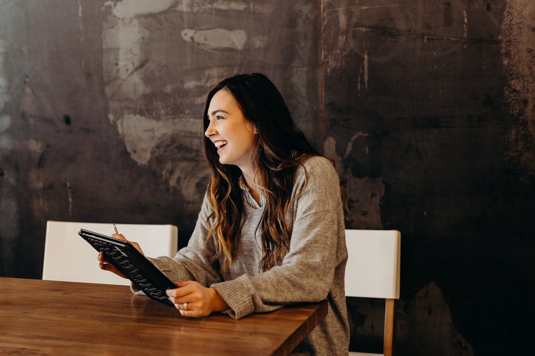 Business owner reviewing AI model pricing invoice at her desk