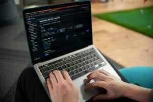 Web administrator checking DNS propagation status on a laptop