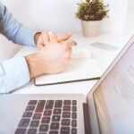 Freelancer reviewing a freelance retainer contract at a desk
